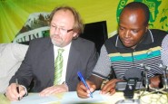 Young Africans Sports Club New Head Coach, Tom Saintfiet (left) signed a two year contract at the club house, infront of Yanga C.E.O Mwesigwa Selestine